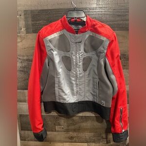 This is a BMW Motorrad AirFlow summer motorcycle jacket.